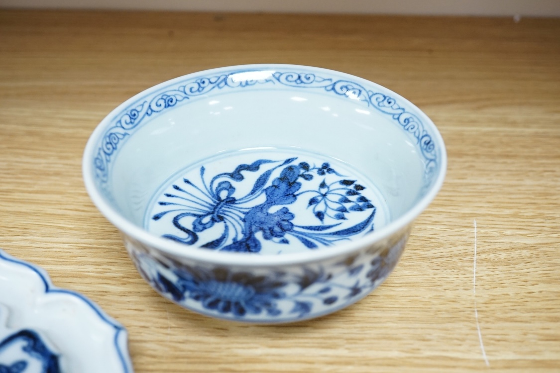 Two Chinese blue and white bowls and a lotus shaped tea pot stand, largest 15cm in diameter